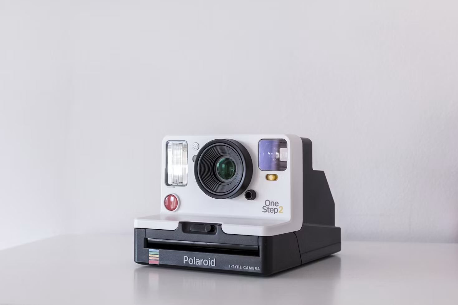 Reference image of an off-white and black instant camera